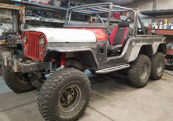 6x6 Jeep complete with Roll Cage.